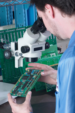 man working on a circuit board